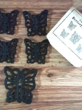 Cast Iron Butterfly Trivets 5 Total 1 is 5 x 4 1/4 & 4 are 3 1/2"x 3 1/2" In Box